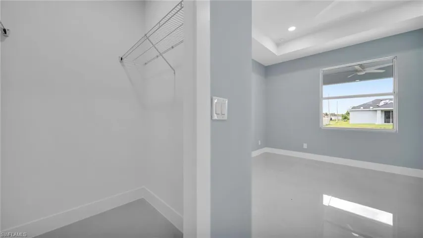 Walk in closet featuring ceiling fan