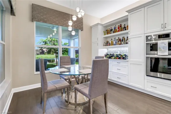 Dining room featuring dark hardwood flooring