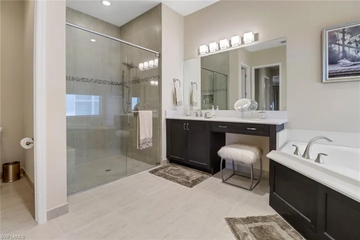 Bathroom with vanity, independent shower and bath, and tile  flooring
