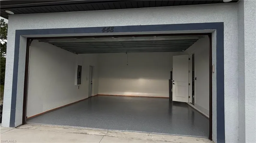 Garage featuring electric panel