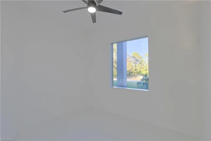 Spare room with a ceiling fan