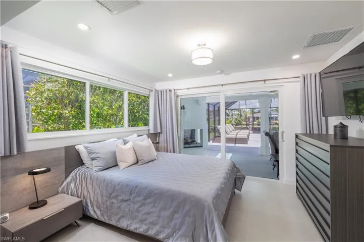 Bedroom with access to outside and recessed lighting