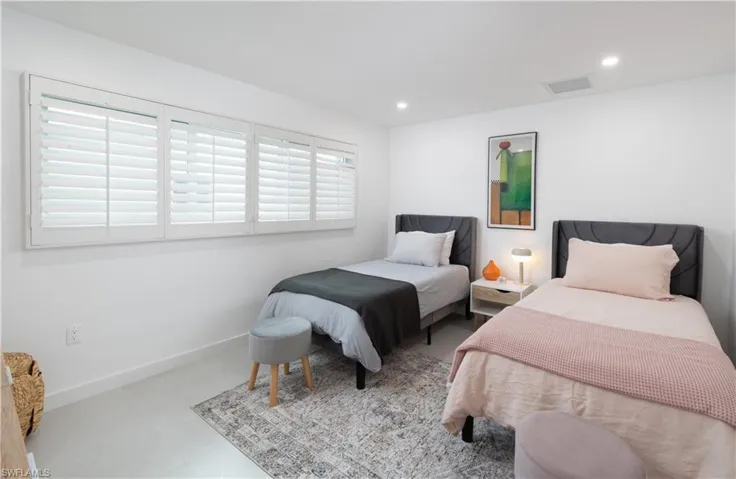 Bedroom with recessed lighting and baseboards