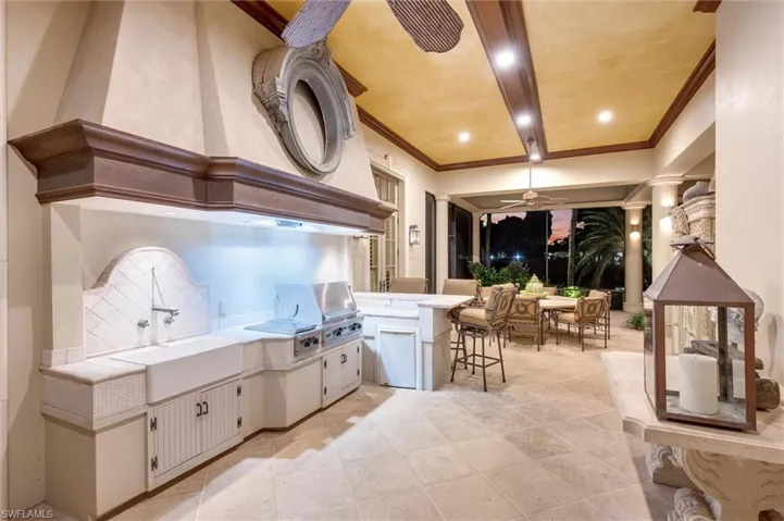 View of patio / terrace with area for grilling and ceiling fan