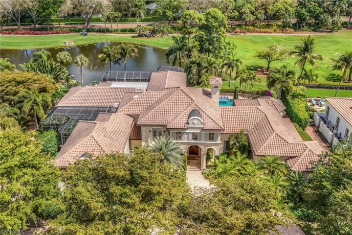 View from above of property featuring a large body of water and a golf course
