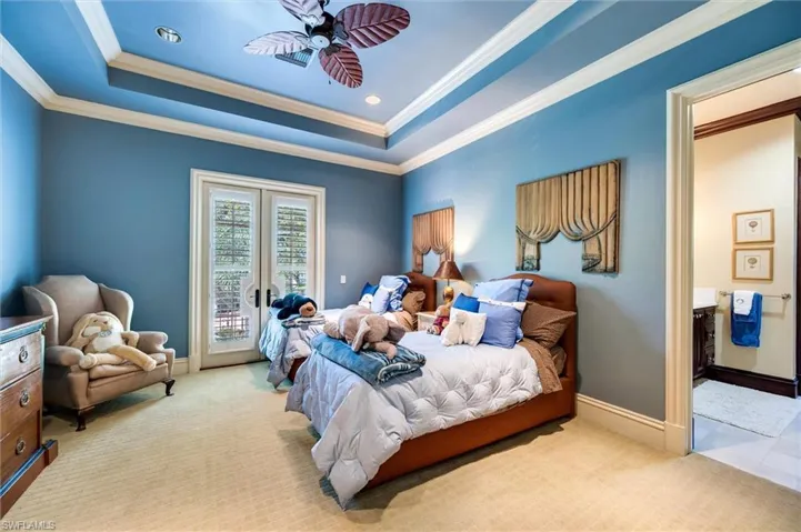 Bedroom with access to outside, light carpet, a ceiling fan, ornamental molding, and french doors
