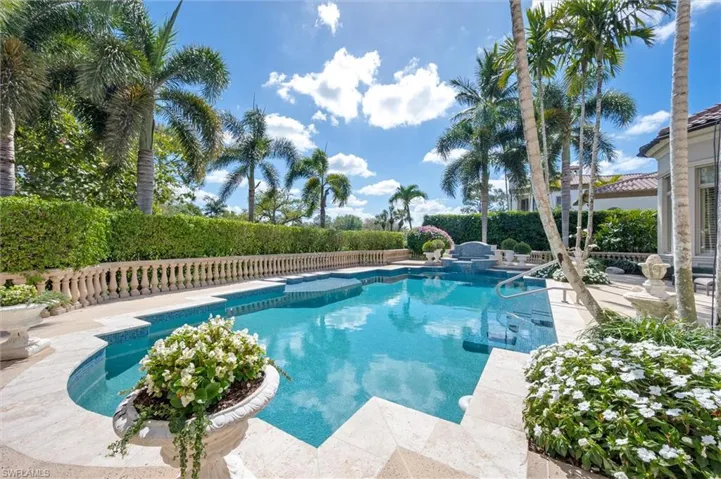 View of pool with patio surround and a fenced backyard
