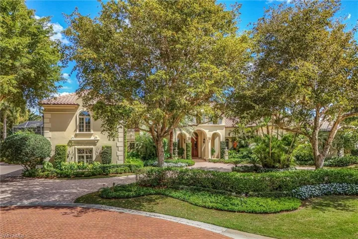 Mediterranean / spanish house with stucco siding and a tiled roof