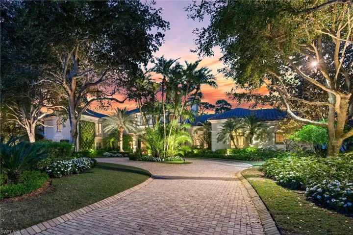 View of front of home with curved driveway