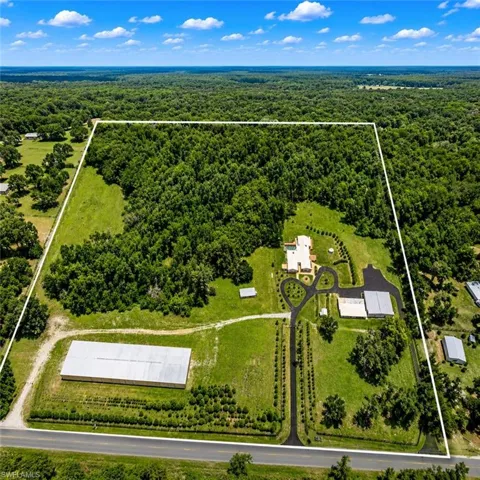 A rare automotive paradise featuring over 100-car capacity across multiple professional-grade structures. From the dedicated paint booth and expansive garage space to the massive commercial facility, this estate offers unmatched opportunities for collectors, enthusiasts, and business owners alike.