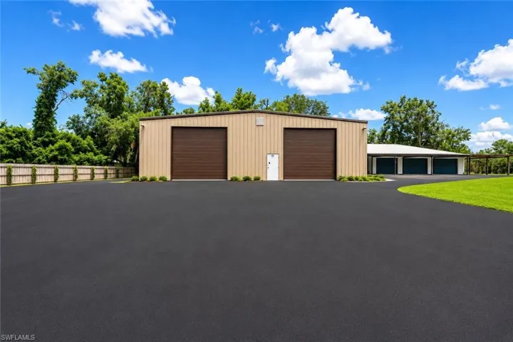 Oversized detached garage structure offering substantial capacity for vehicles, equipment, or workshop use. Ideal for collectors, contractors, or storage-intensive needs.