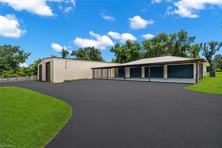 Second detached garage building providing additional covered storage and workspace, enhancing functionality and flexibility across the property.