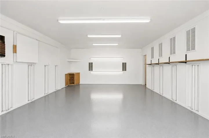 Primary garage building providing extensive storage and workspace flexibility rarely found on acreage properties.