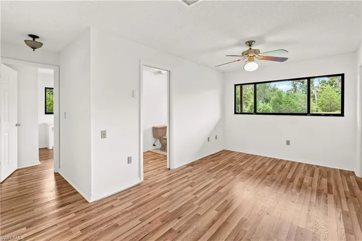 Comfortable guest bedroom offering a peaceful retreat with a functional layout and natural light.