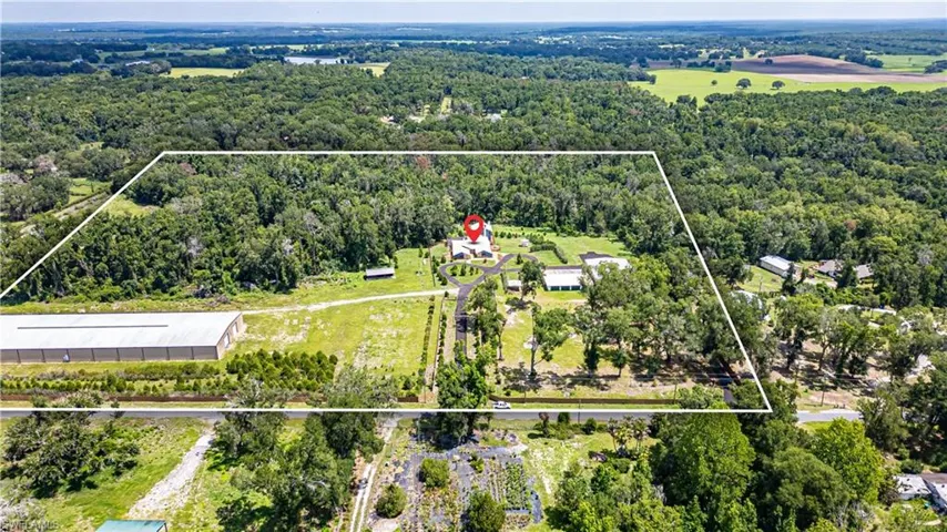 Expansive outdoor space surrounded by natural Florida landscape, offering privacy, open land use, and endless potential for future improvements or expansion.