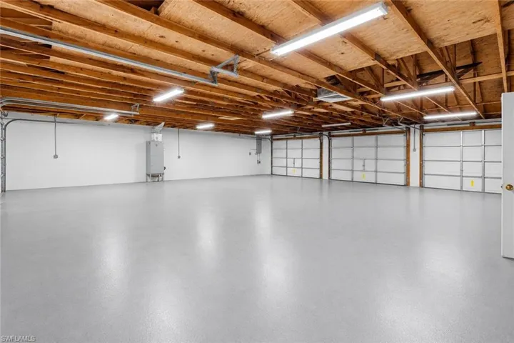 Expansive garage infrastructure featuring two separate buildings with combined 8-car capacity, ideal for collectors or those seeking elevated storage and utility options.