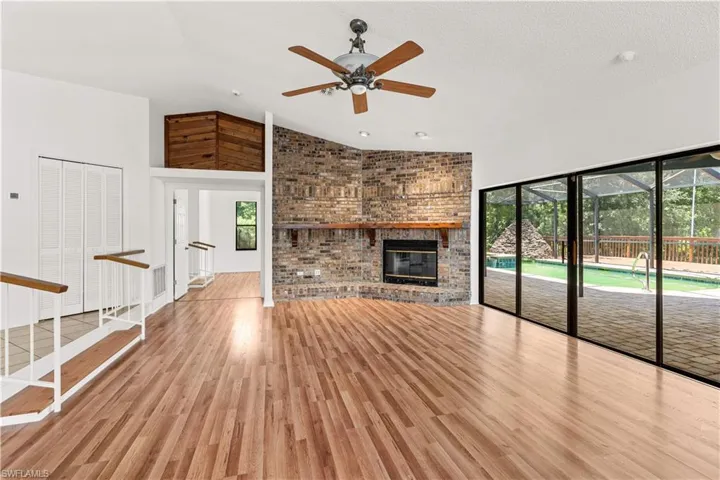 Warm and inviting living space centered around a fireplace, creating a cozy focal point ideal for relaxed evenings and intimate gatherings.