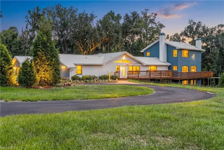 Peaceful country setting featuring a single-family residence on over 24 acres of private, usable land with mature surroundings and endless potential.