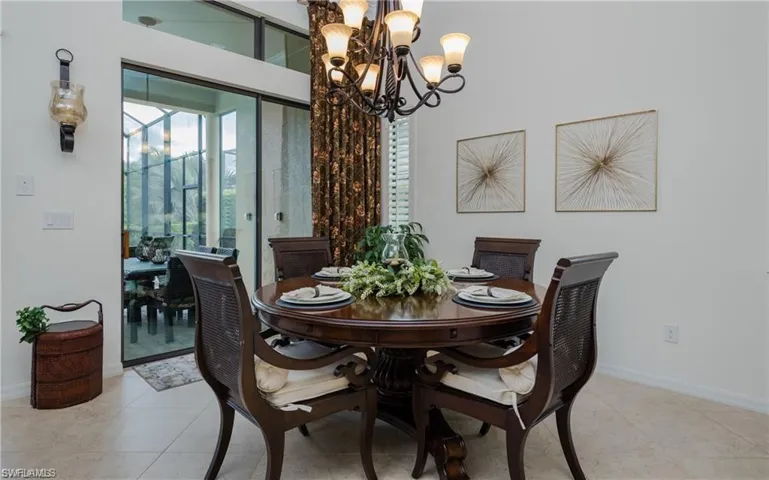 Dining space with a chandelier and light tile patterned floors