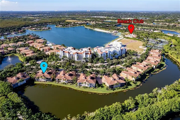 Aerial view of property and surrounding area with nearby suburban area
