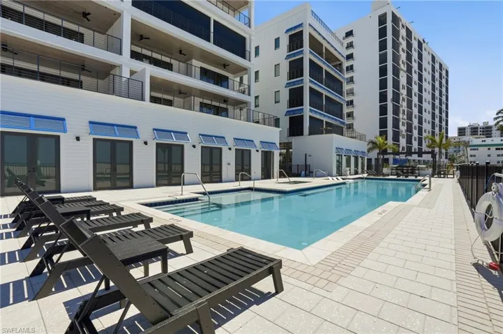 Community pool with a patio