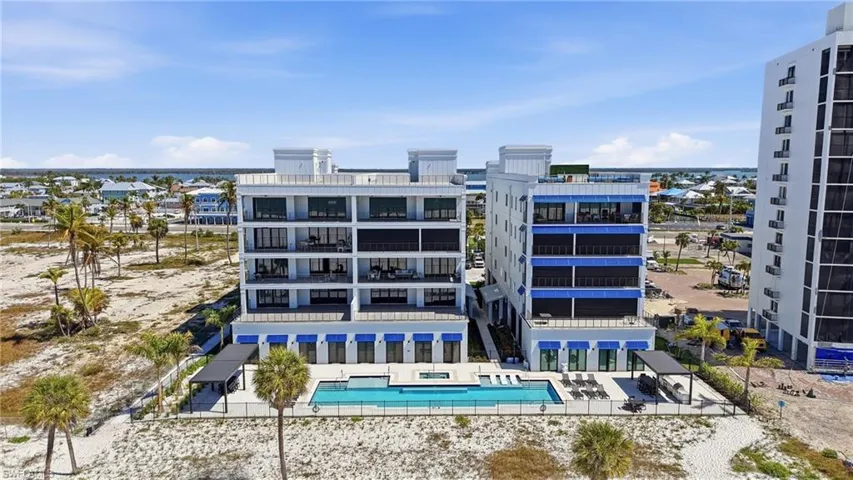 View of property with a community pool