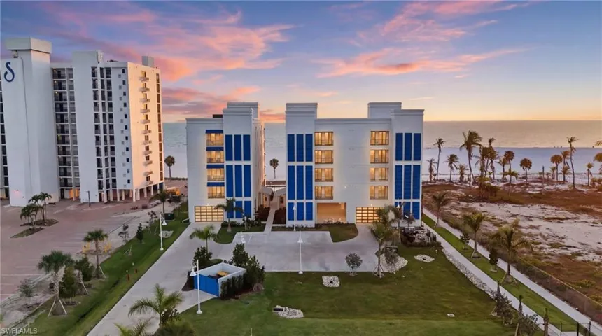 Property at dusk featuring a water view