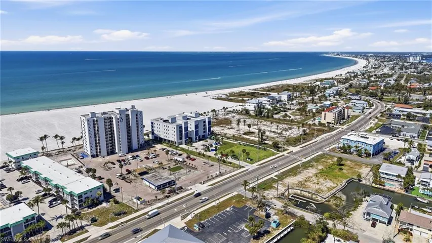 Aerial view of extended coastline and apartment complex