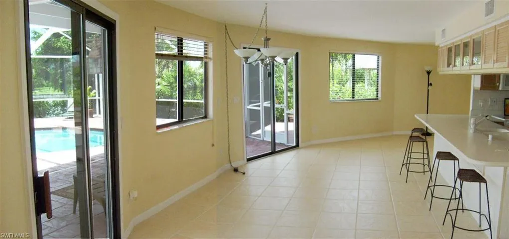 Dinning and part of the living Area on Poolside with kitchen bar