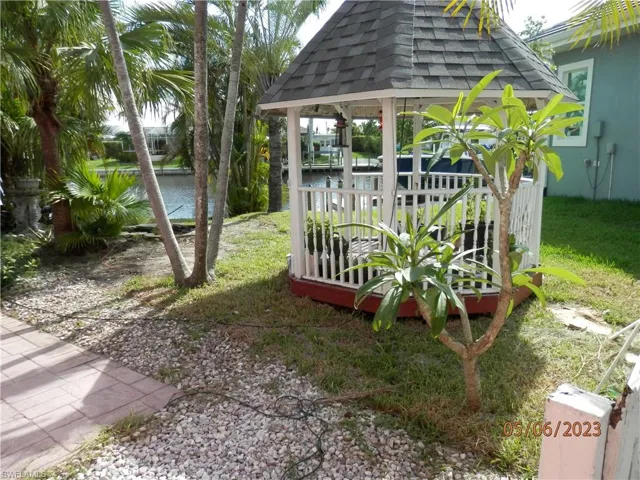 View of yard and canal with a gazebo