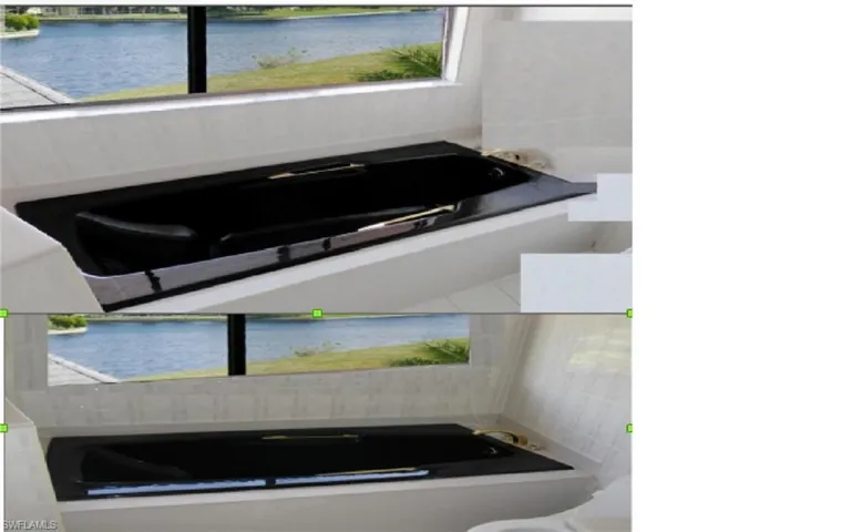 Master Bathroom with newer black bathtub a water view