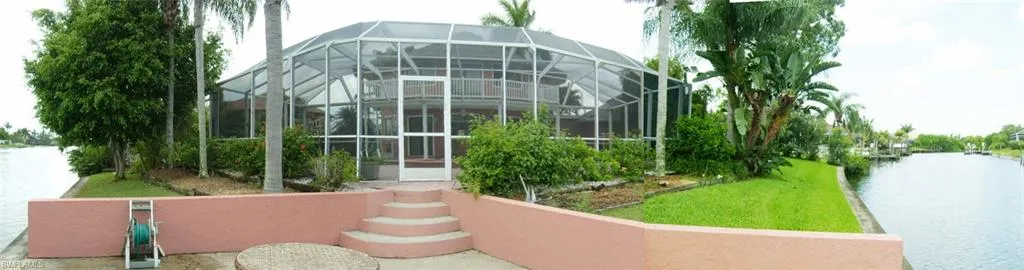 Panorama View from the dock to the property with the yard and the two canal water view
