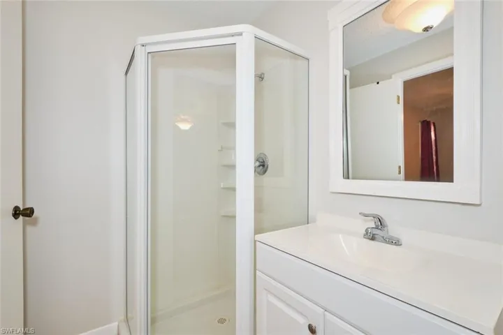 Primary Bathroom with vanity and an enclosed walk in shower