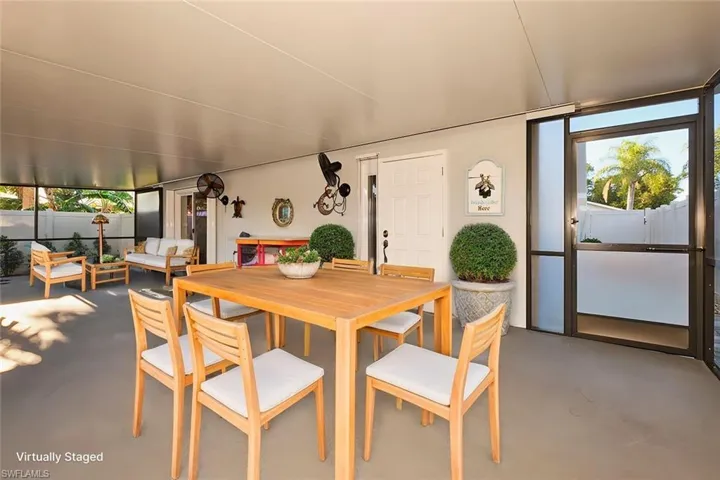 Dining area featuring concrete flooring and separate entrance to the second bedroom