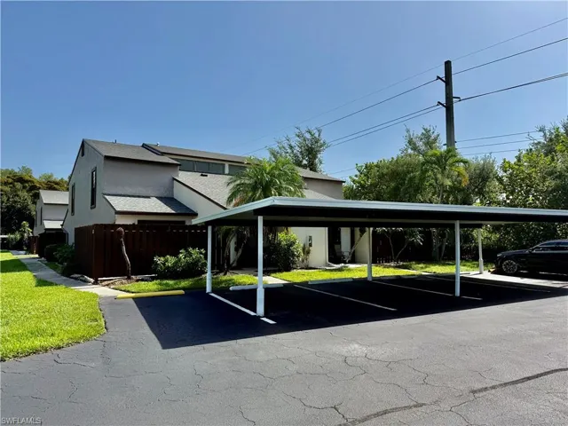 Front of building with covered parking.