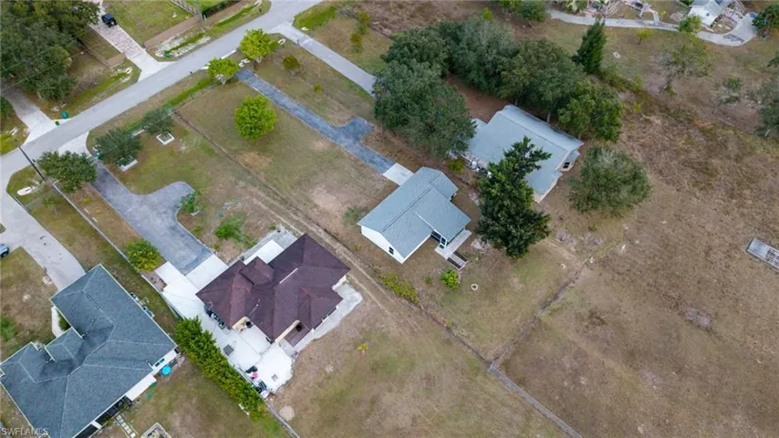 Aerial overview of property's location with nearby suburban area