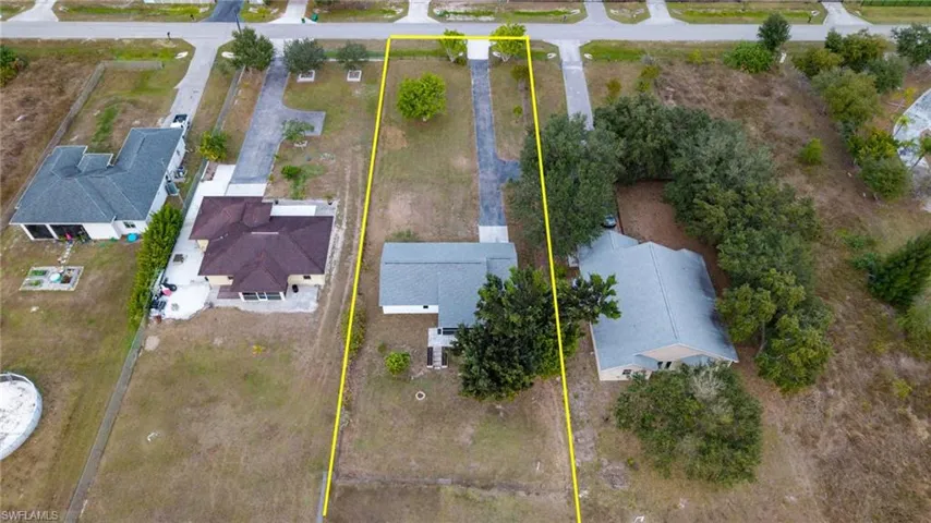 Aerial overview of property's location featuring property parcel outlined