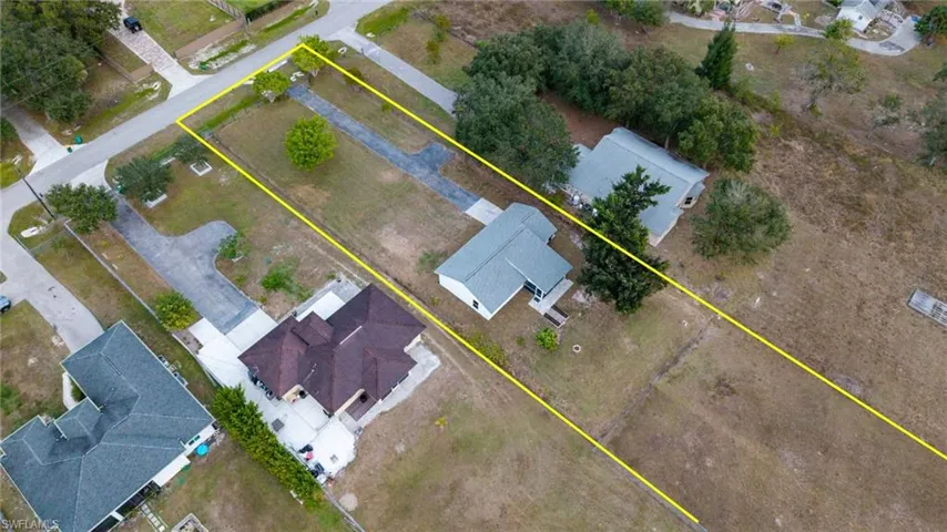 Aerial view of residential area with property boundaries highlighted