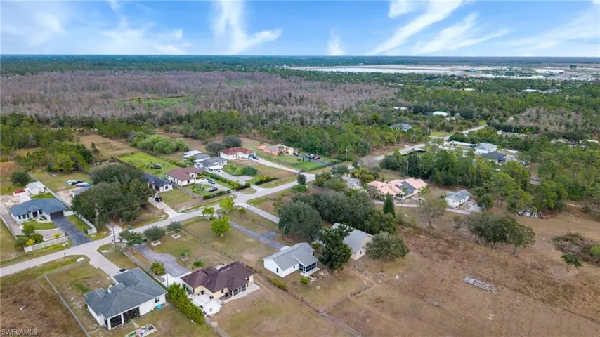 View of property location with nearby suburban area