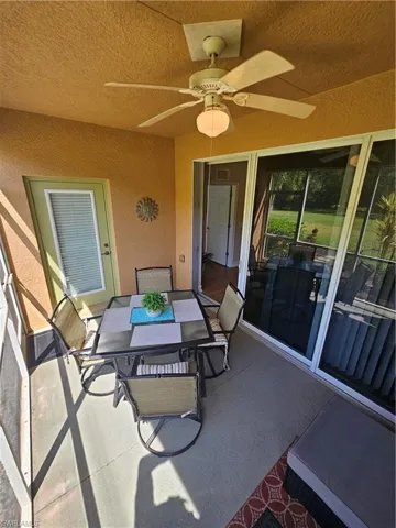 View of patio / terrace with ceiling fan and outdoor dining area