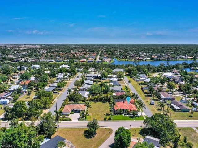 Aerial view of residential area with a large body of water