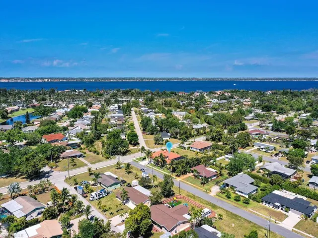 Aerial view of residential area with a large body of water