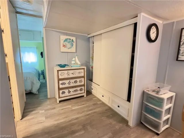 Hall featuring light wood finished floors
