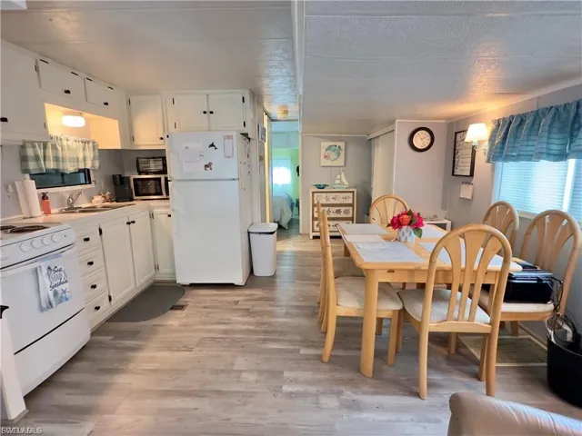 Dining area featuring light wood-style flooring