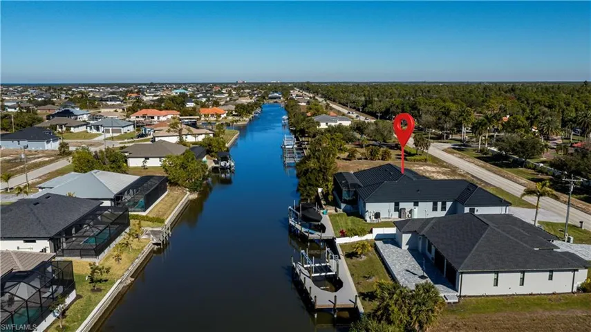 Aerial view of residential area with a nearby body of water