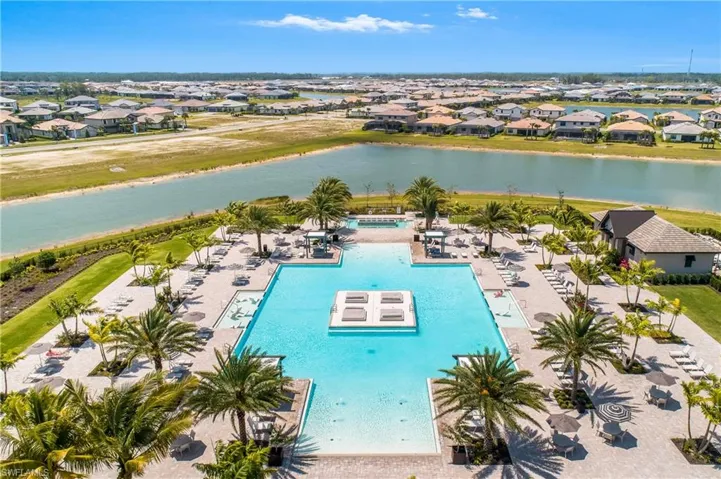 Community pool with a residential view, a water view, and a patio