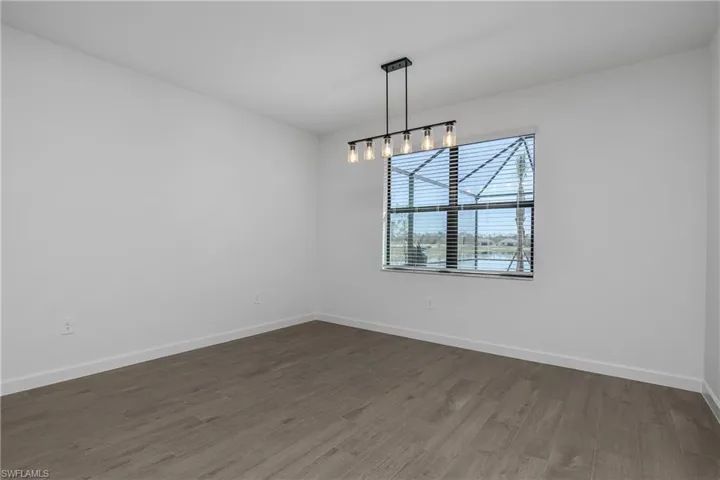 Dining room with custom lighting and beautiful long water views.