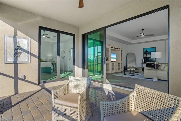 Enjoy seamless indoor/outdoor living - POOLSIDE, on your private lanai. (photo is from staged home in community)