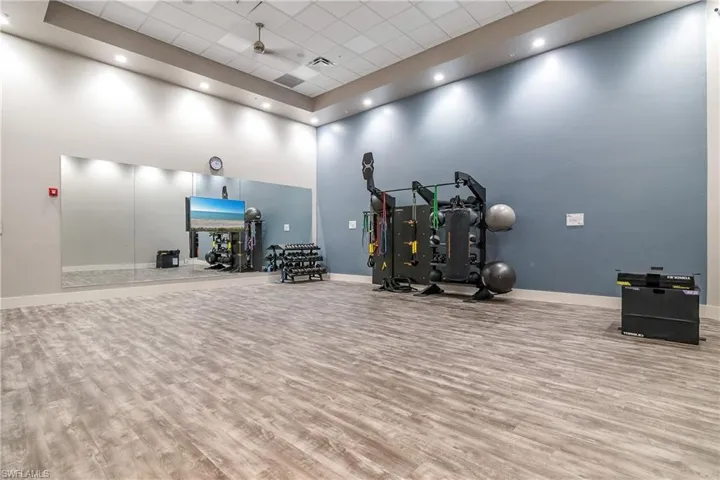 Exercise room featuring a high drop ceiling