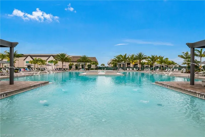 Community pool with a patio